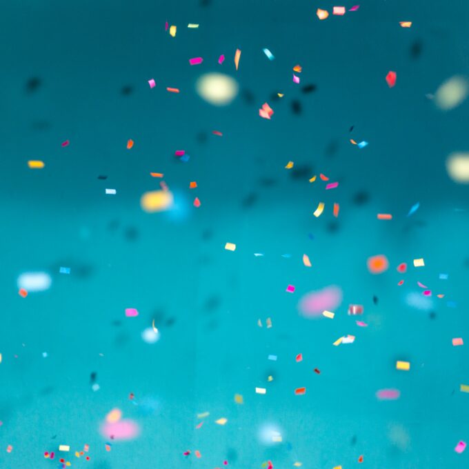 confetti falling on a blue background