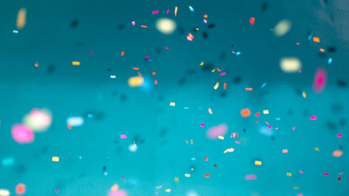 confetti falling on a blue background